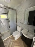 Tiny house «Complete Deluxe» 36 m² – minicasa expandible con 2 dormitorios y cocina en L