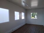 Contenedor de oficina monobloque 18 m² (6x3 m) – aislamiento térmico 100 mm (4 ventanas + calefacción)