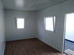 Contenedor oficina monobloque 18 m² (6x3 m) con baño – aislamiento premium 100 mm (uso 4 estaciones)