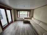 Casa móvil «Chalet Wood Gray» 10,8 x 3,7 m – diseño moderno con bow window y doble entrada