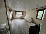Casa móvil «Chalet Wood Gray» 10,8 x 3,7 m – diseño moderno con bow window y doble entrada