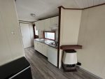 Casa móvil «Chalet Wood Gray» 10,8 x 3,7 m – diseño moderno con bow window y doble entrada