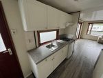 Casa móvil «Chalet Wood Gray» 10,8 x 3,7 m – diseño moderno con bow window y doble entrada