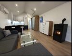 Nueva casa móvil 10x4 m «Modelo II» – tejado 30° con calefacción híbrida y chimenea de pellets (bajo pedido)