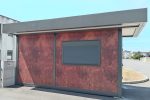 Garita prefabricada «Architectural» (6×3,5 m) – acabado Corten, baño para personas con movilidad reducida e informe energético
