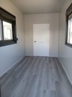 Garita prefabricada «Architectural» (6×3,5 m) – acabado Corten, baño para personas con movilidad reducida e informe energético