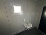 Contenedor sanitario 20 pies usado (6×2,4 m) – bloque de 6 duchas con caldera de 300 l y lavandería