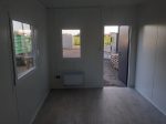 Contenedor sanitario vestuario 6×2,9 m – doble entrada con ducha y 2 inodoros (aislamiento 100 mm)